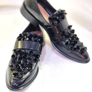 Zara black sequin patent leather loafers.